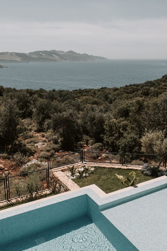 Enjoy a breathtaking view of the Mediterranean Sea from a luxurious infinity pool in Antalya, Turkey.